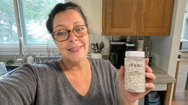 Amanda K. holding her Nuora Gut Ritual